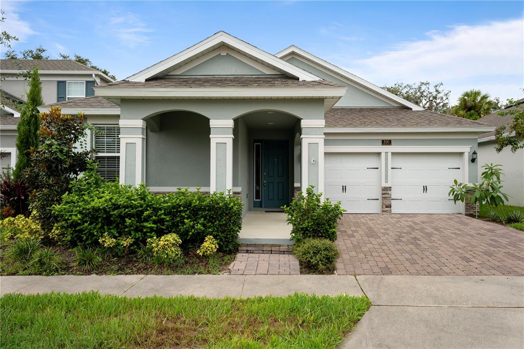 front view of a house with a yard