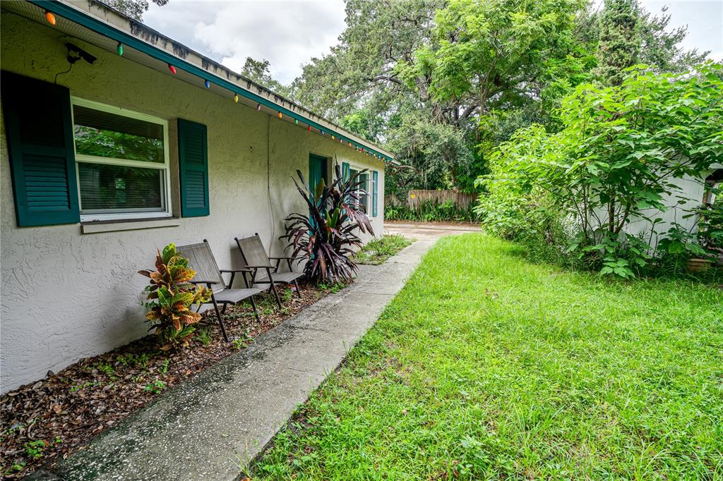 a wooden bench sitting in front of a house