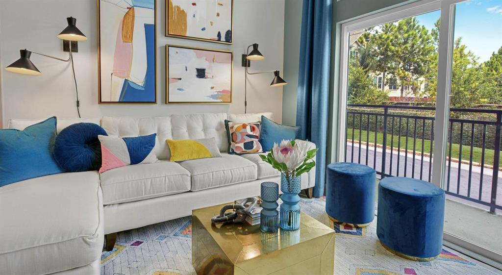 a living room with furniture and a window