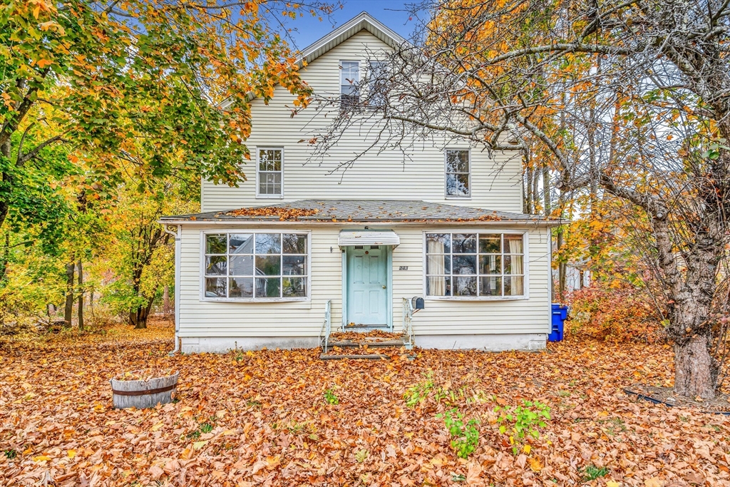 front view of a house with a yard