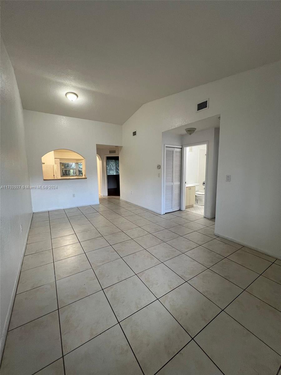 a view of an empty room and window