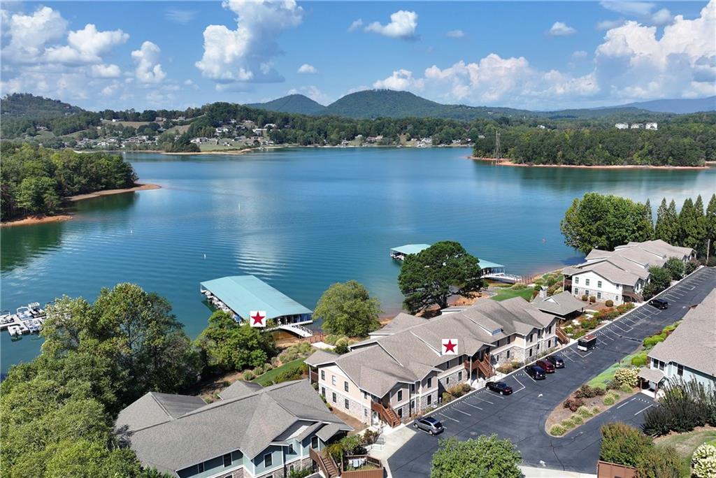 an aerial view of a house with a lake view