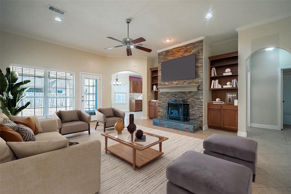 a living room with furniture fireplace and a flat screen tv