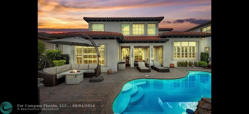 a view of swimming pool with outdoor seating