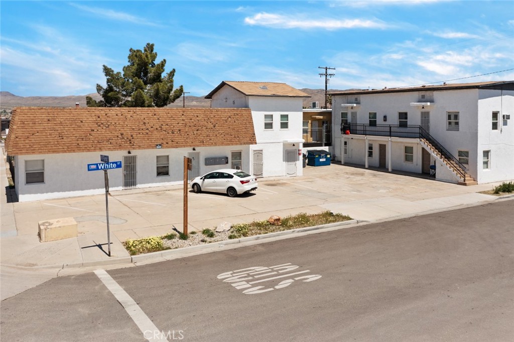 a view of multiple houses with a street