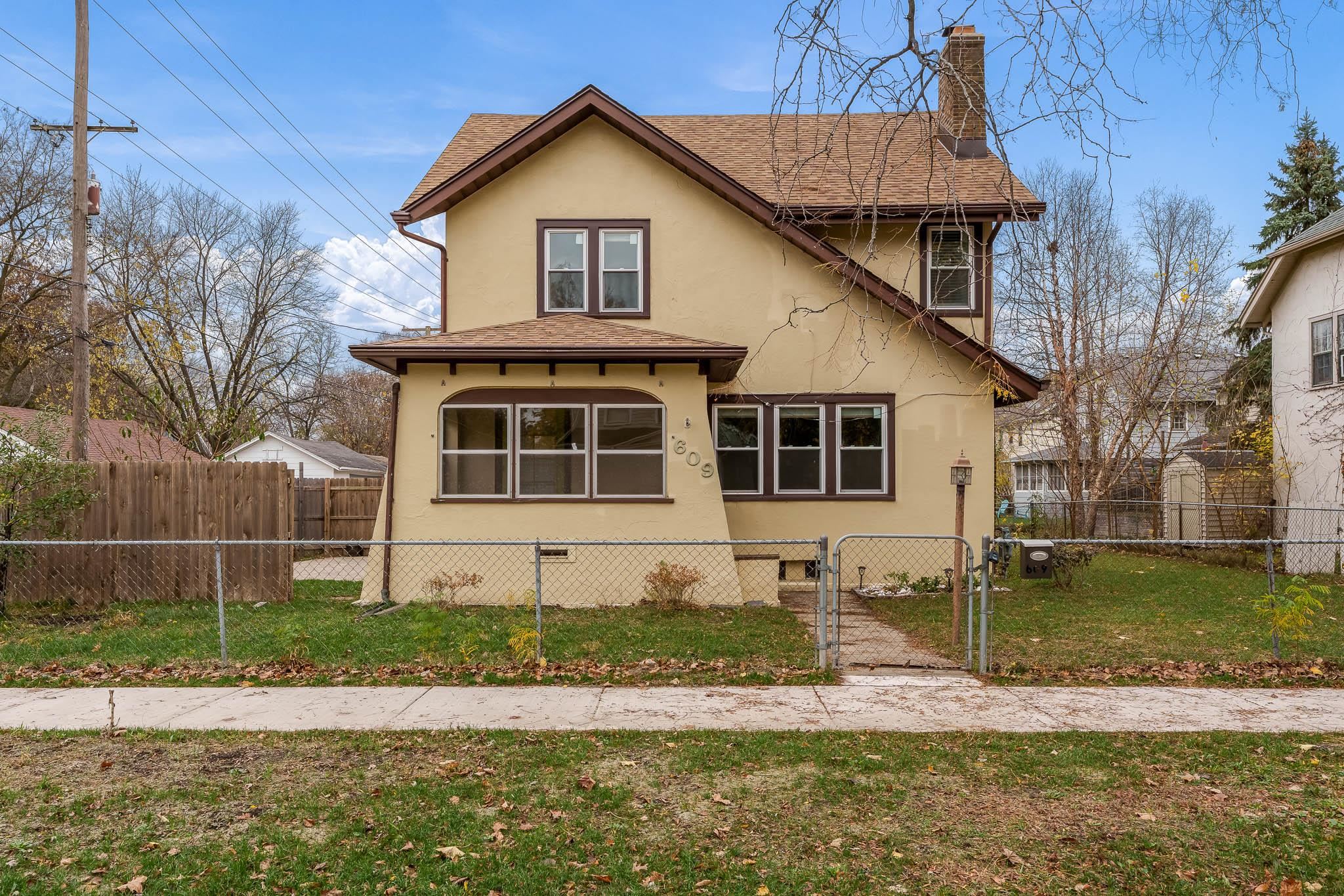 a front view of a house with a yard