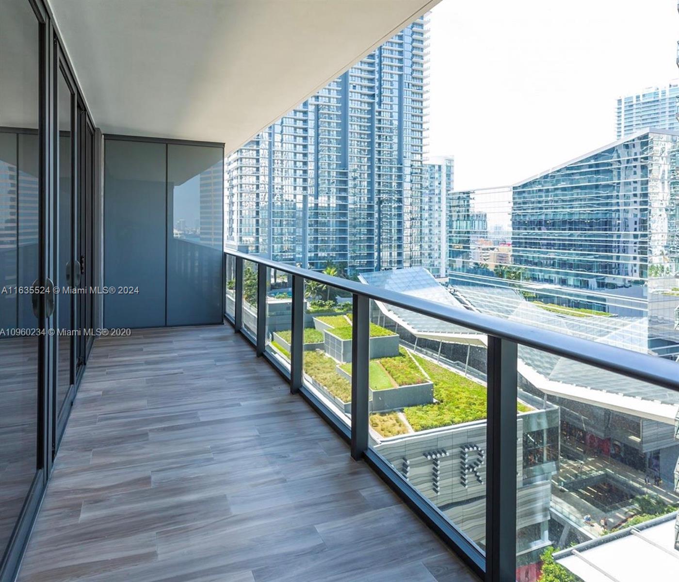 a view of balcony with wooden floor