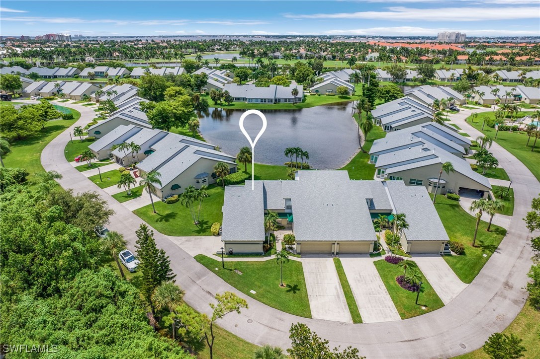 an aerial view of residential houses with outdoor space and street view