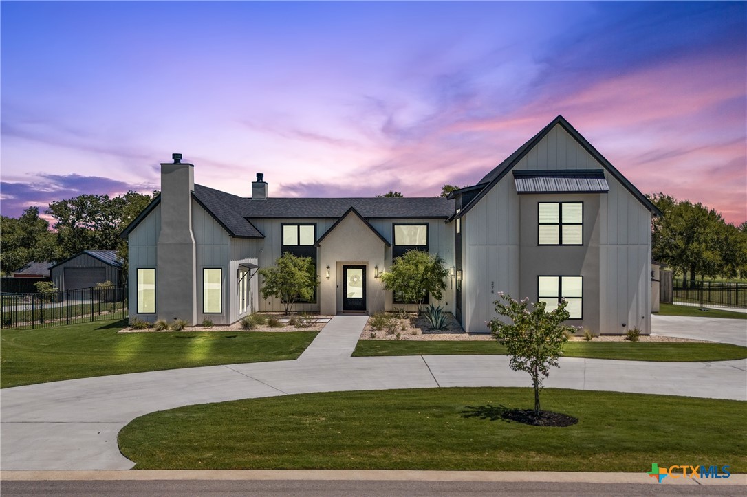 front view of a house with a yard