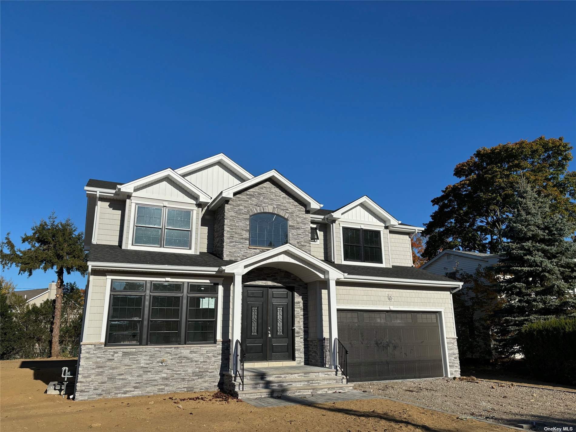 a front view of a house with a garage