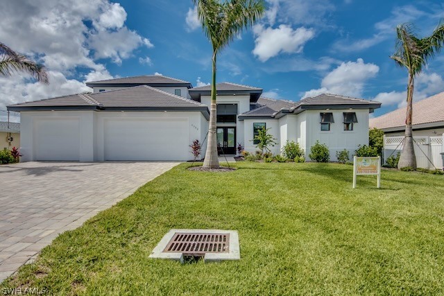 a front view of a house with garden