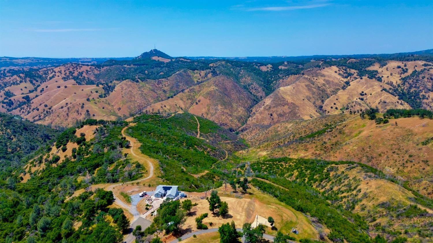 an aerial view of mountain with beach