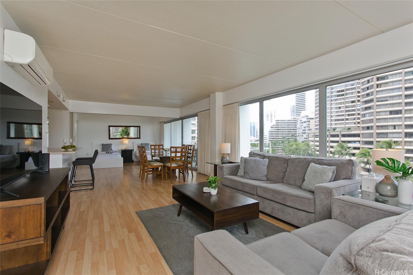 a living room with furniture and a large window