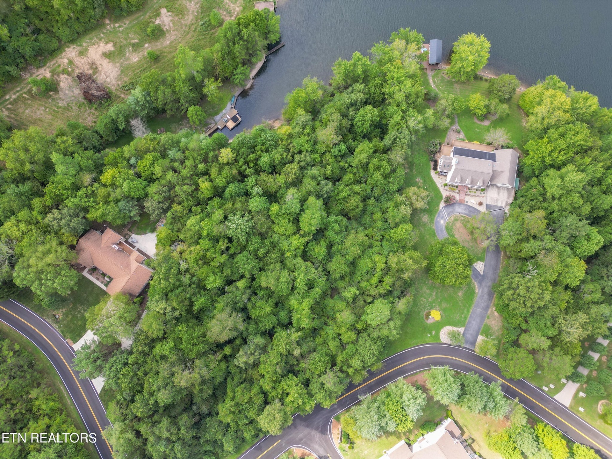 an aerial view of a house having swimming pool