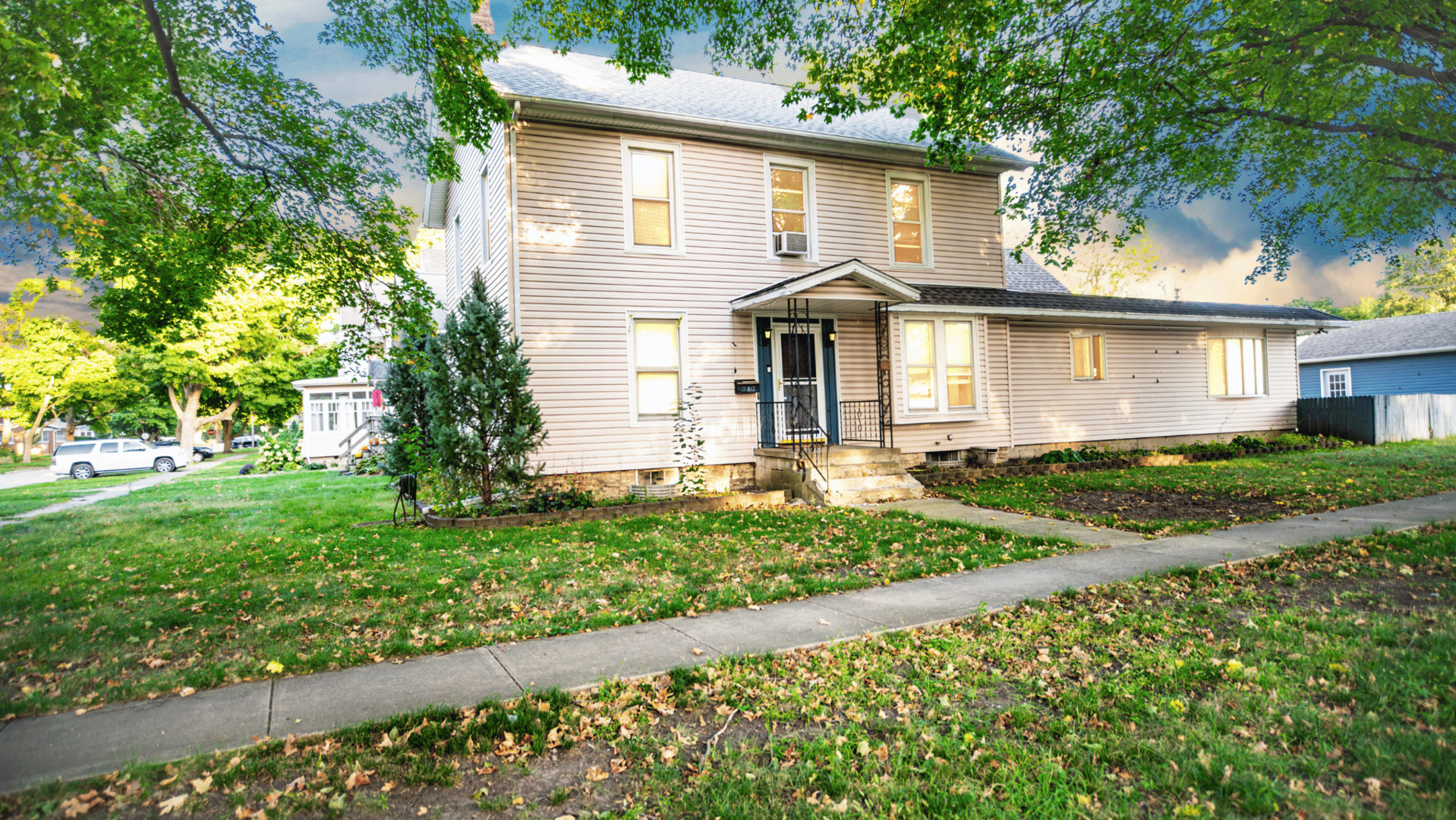 a front view of a house with a yard