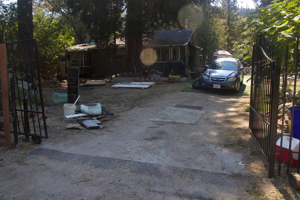 a front view of a house with a garden and patio