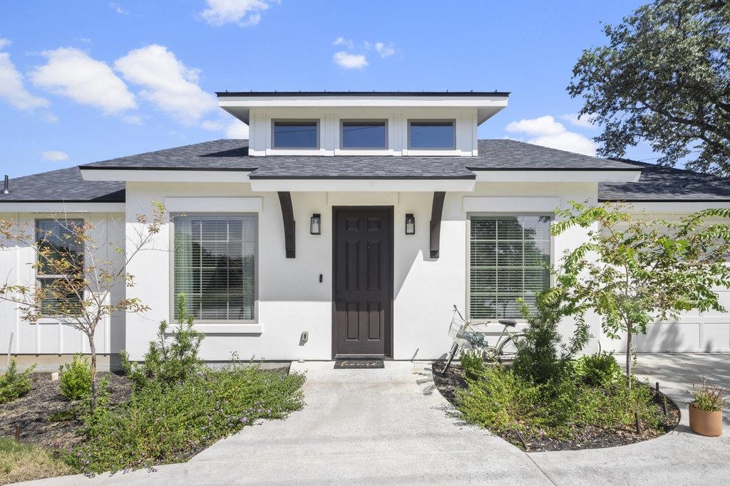 front view of a house with a yard