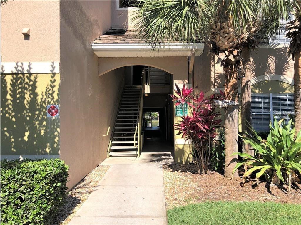 a view of a house with a small yard