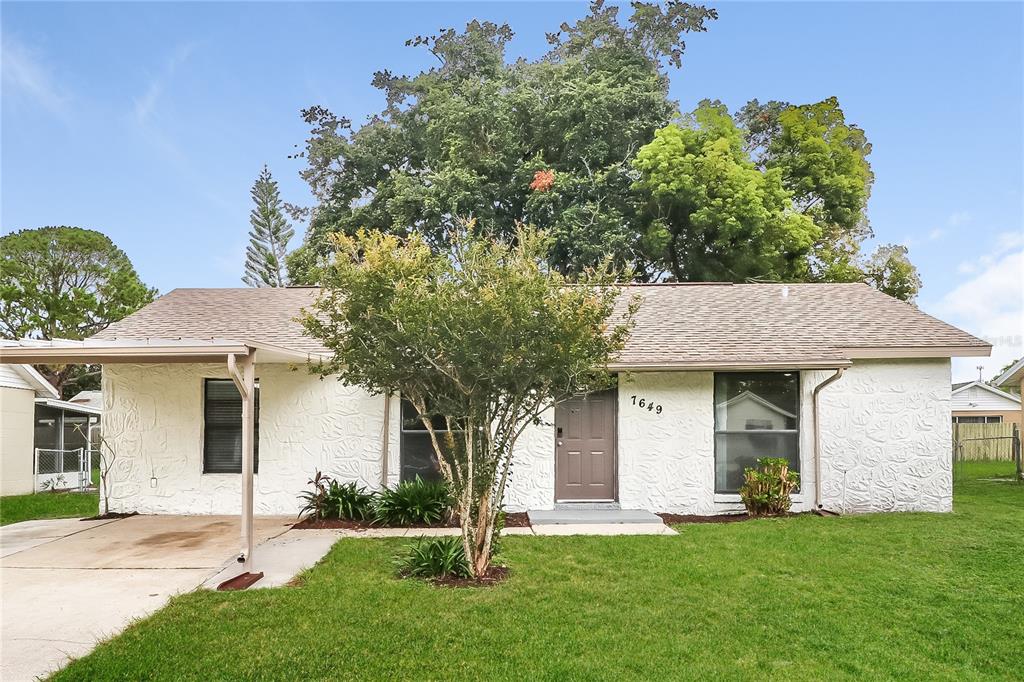 front view of a house with a yard