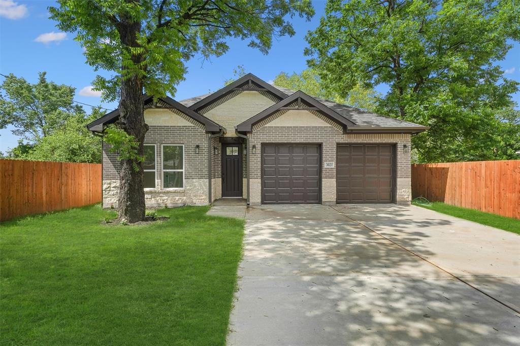 a front view of a house with yard