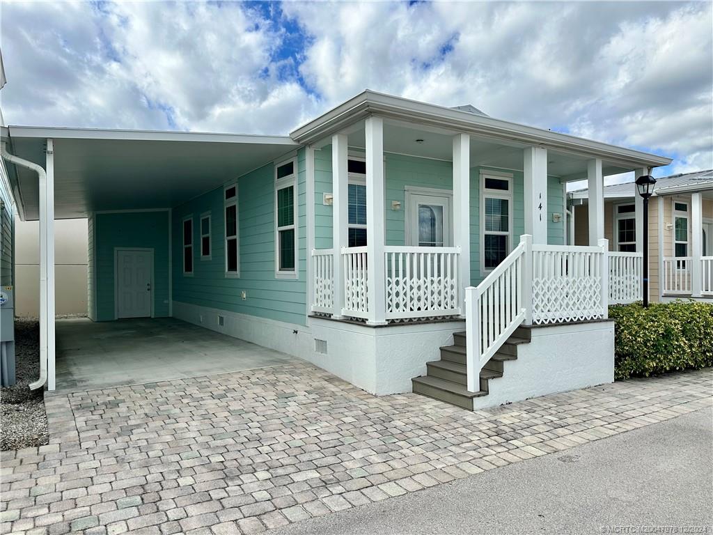 a front view of a house with a porch