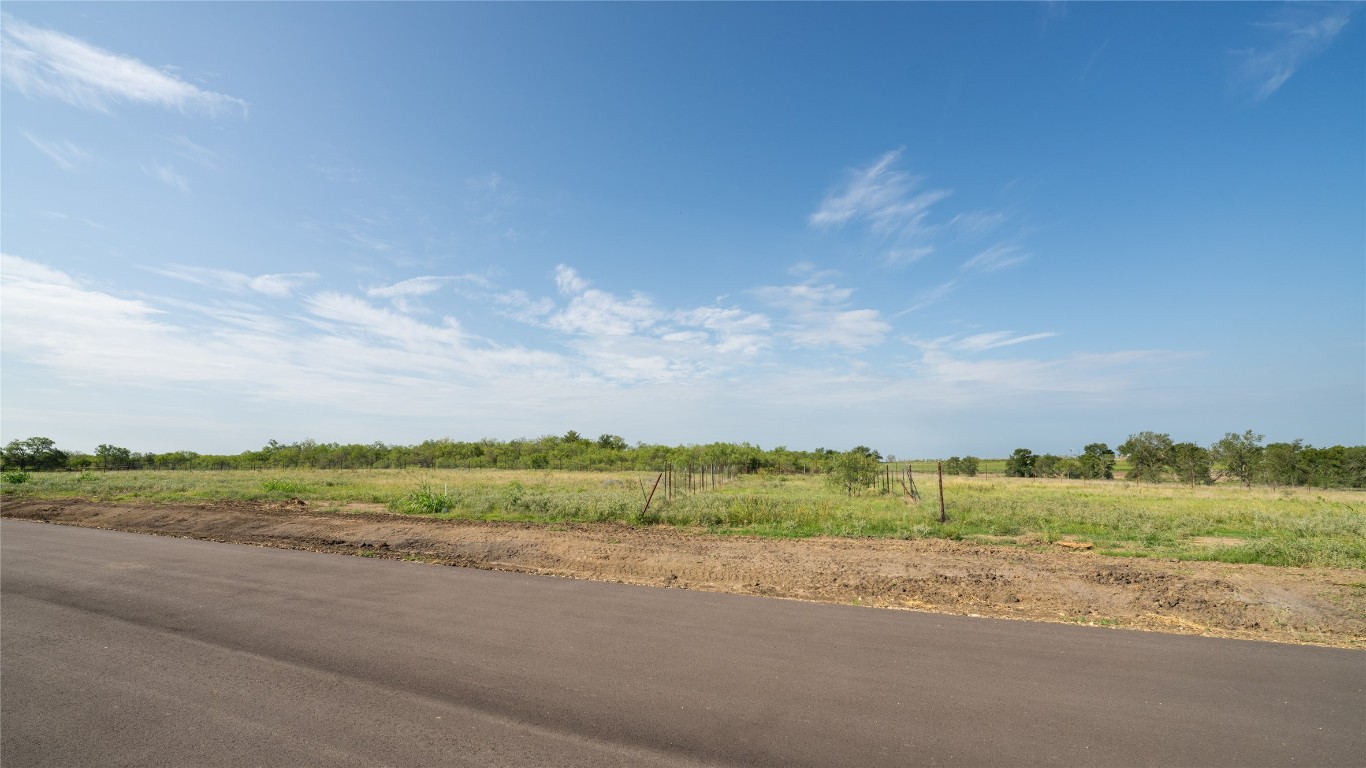 a view of a road and a building in the background