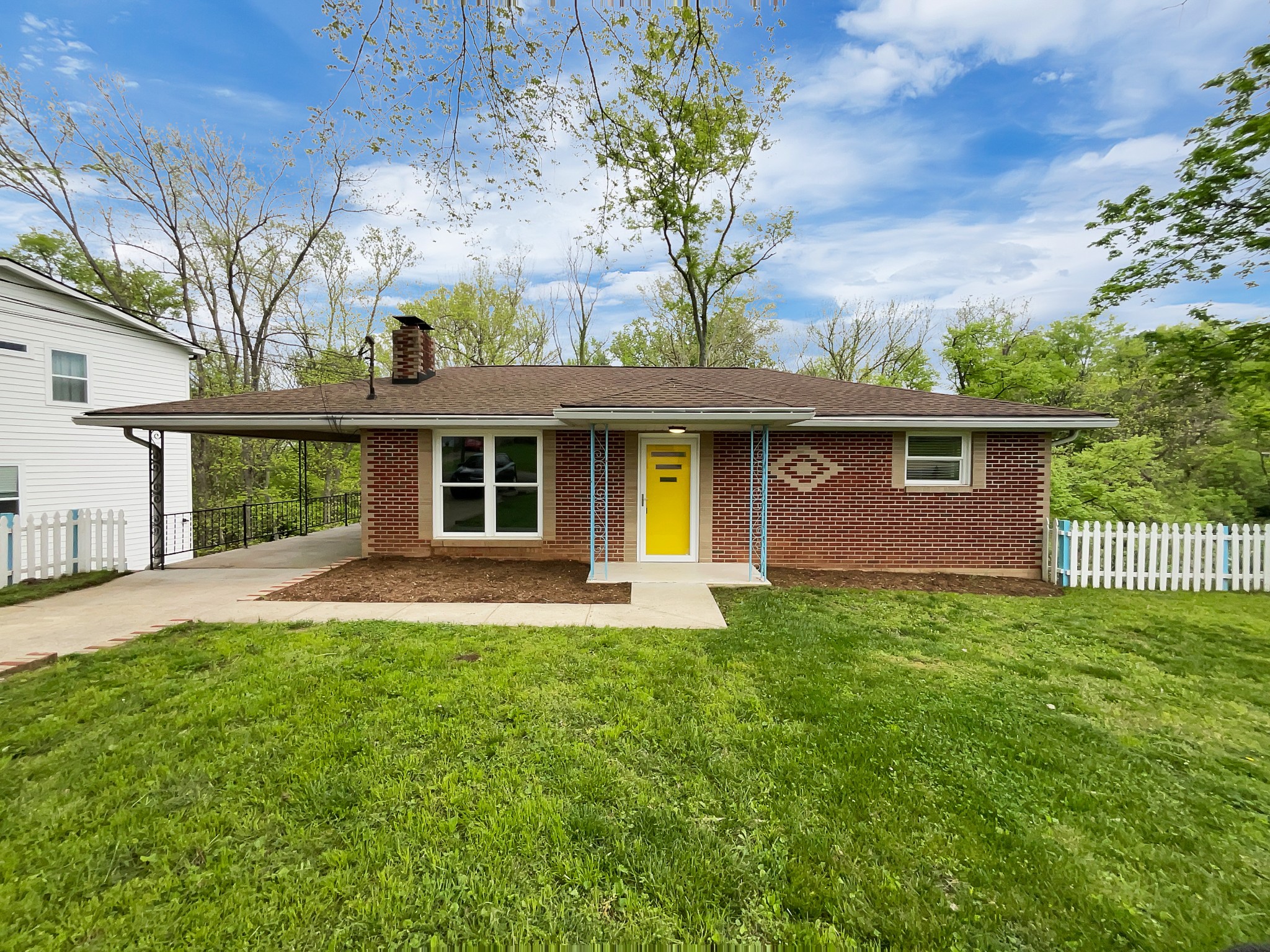 front view of a house with a garden