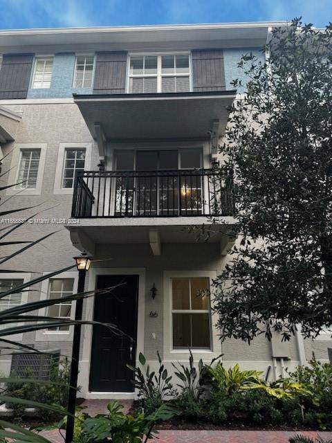 a front view of a house with balcony