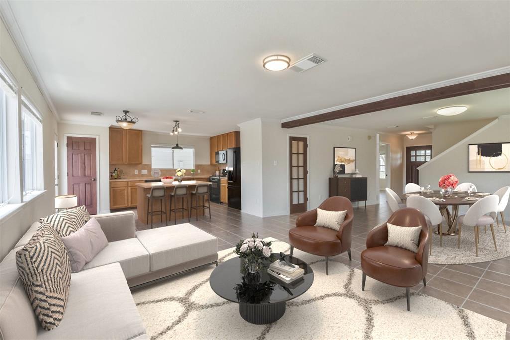 a living room with furniture and kitchen view