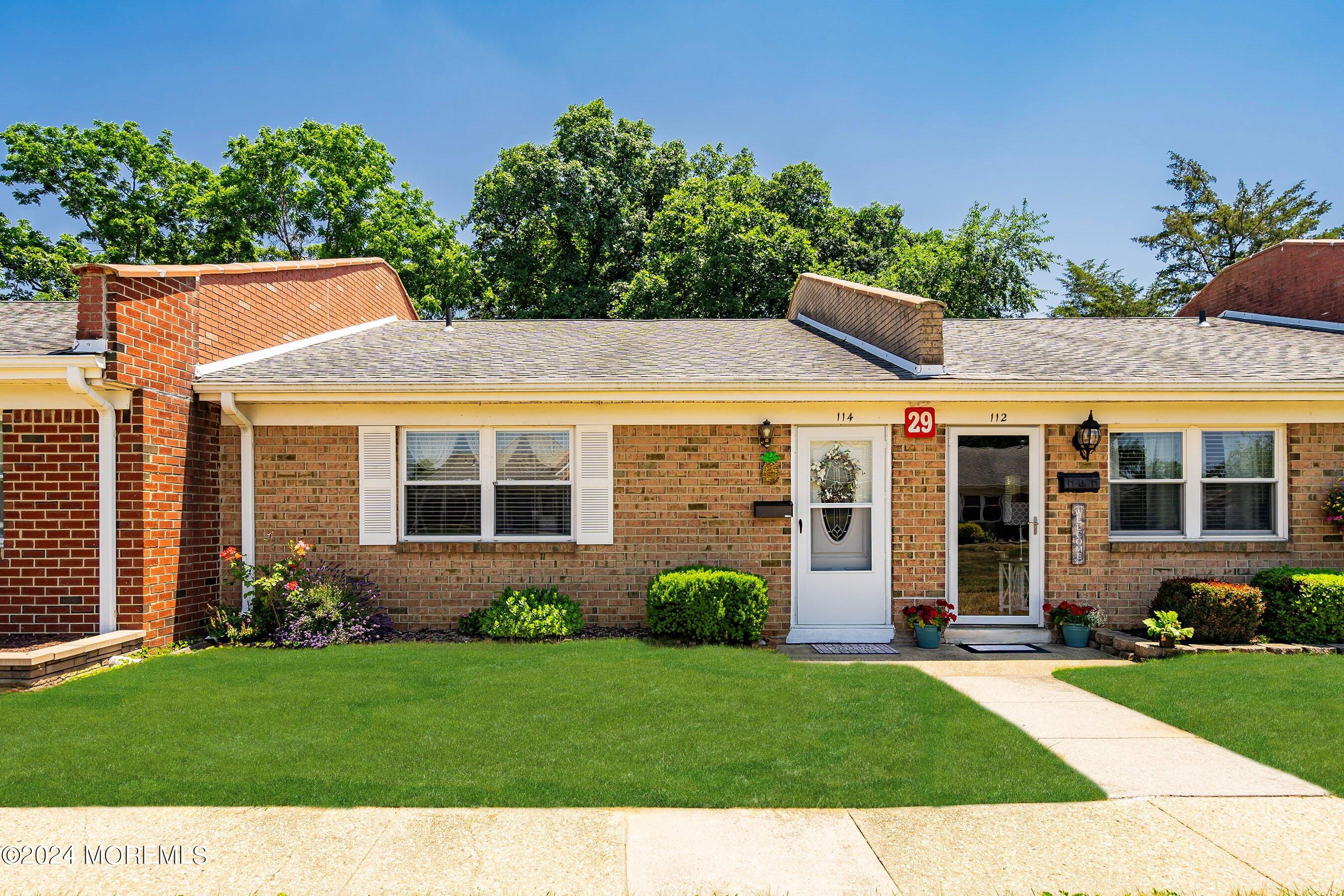 front view of a house with a yard