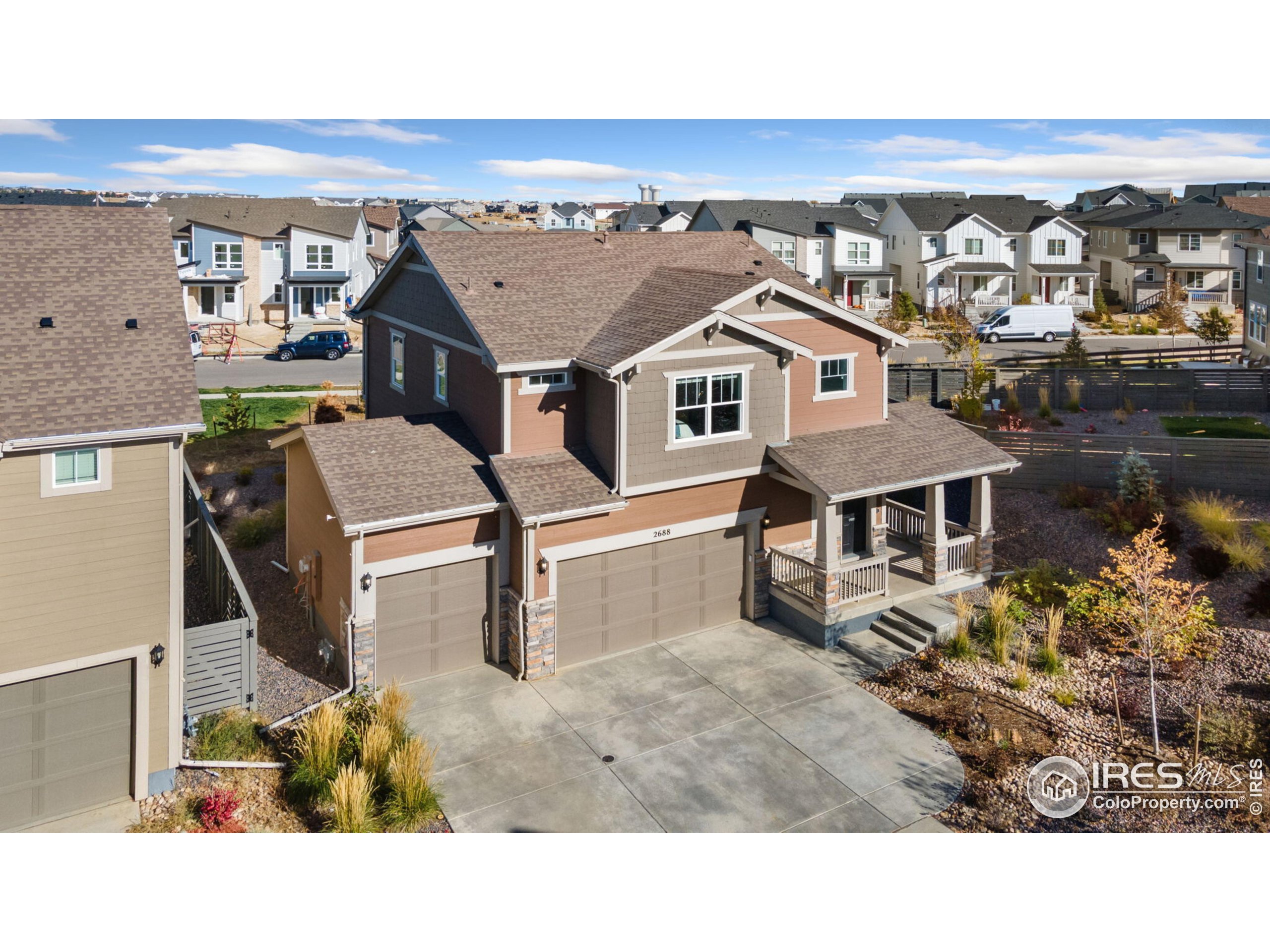 a upper view of a house with backyard porch and wooden floor