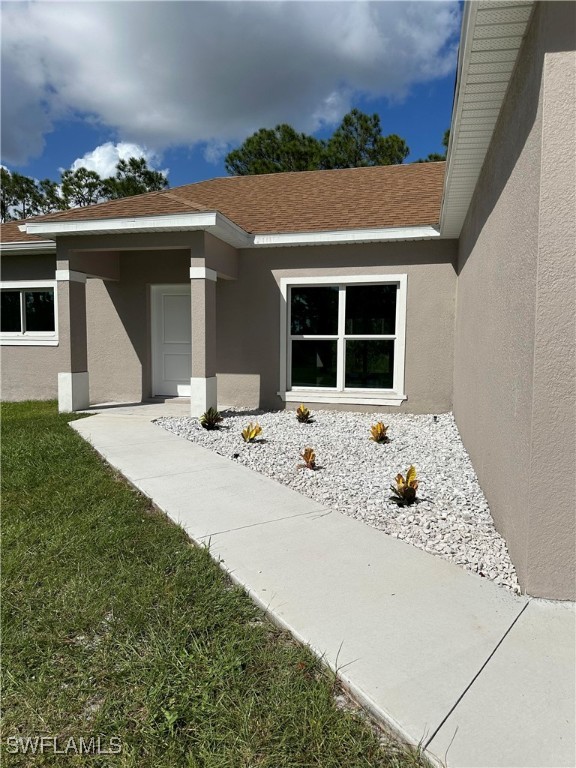 front view of a house with a bench