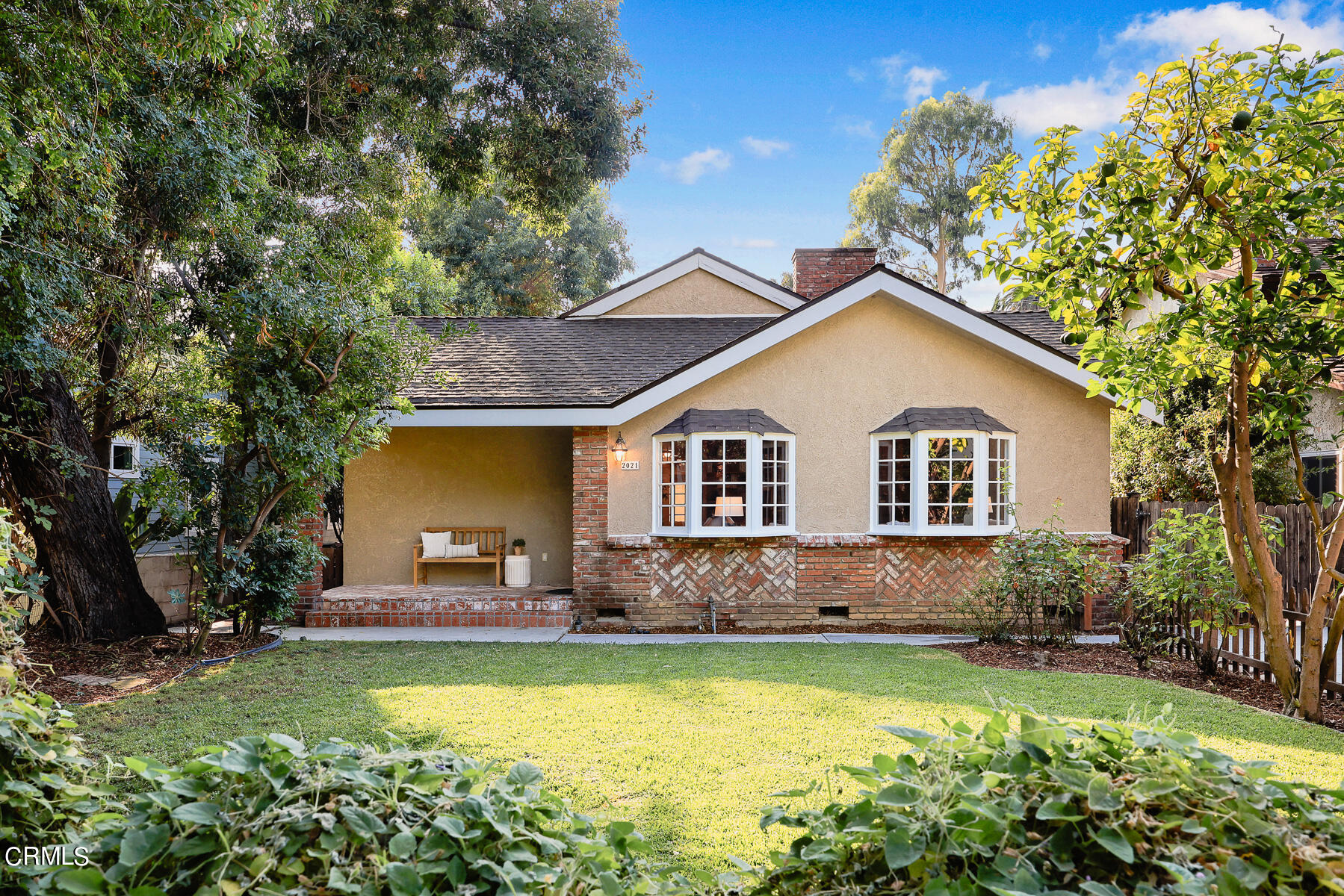 a view of a house with swimming pool and sitting area