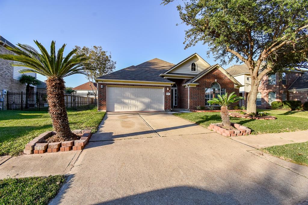 a house with palm tree in front of it