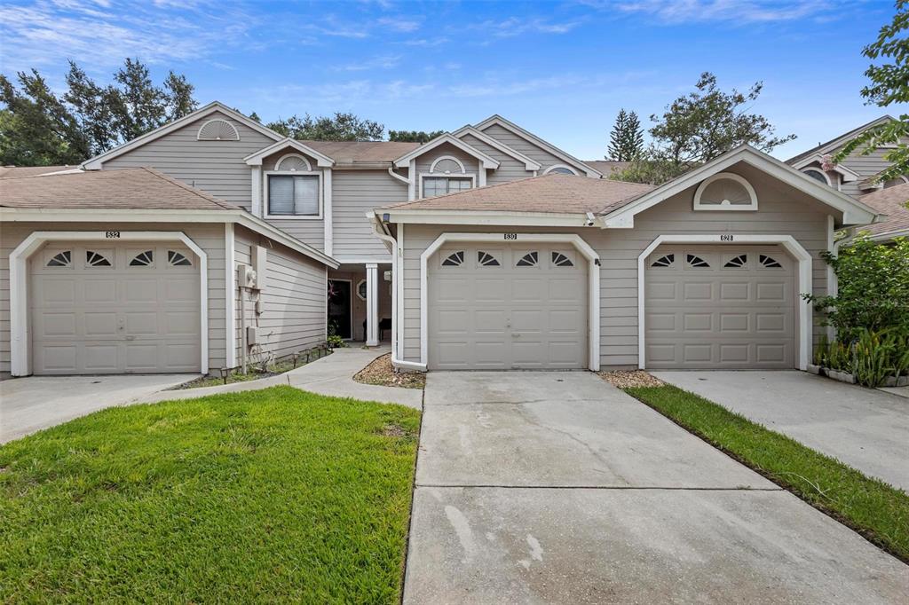 front view of a house with a yard