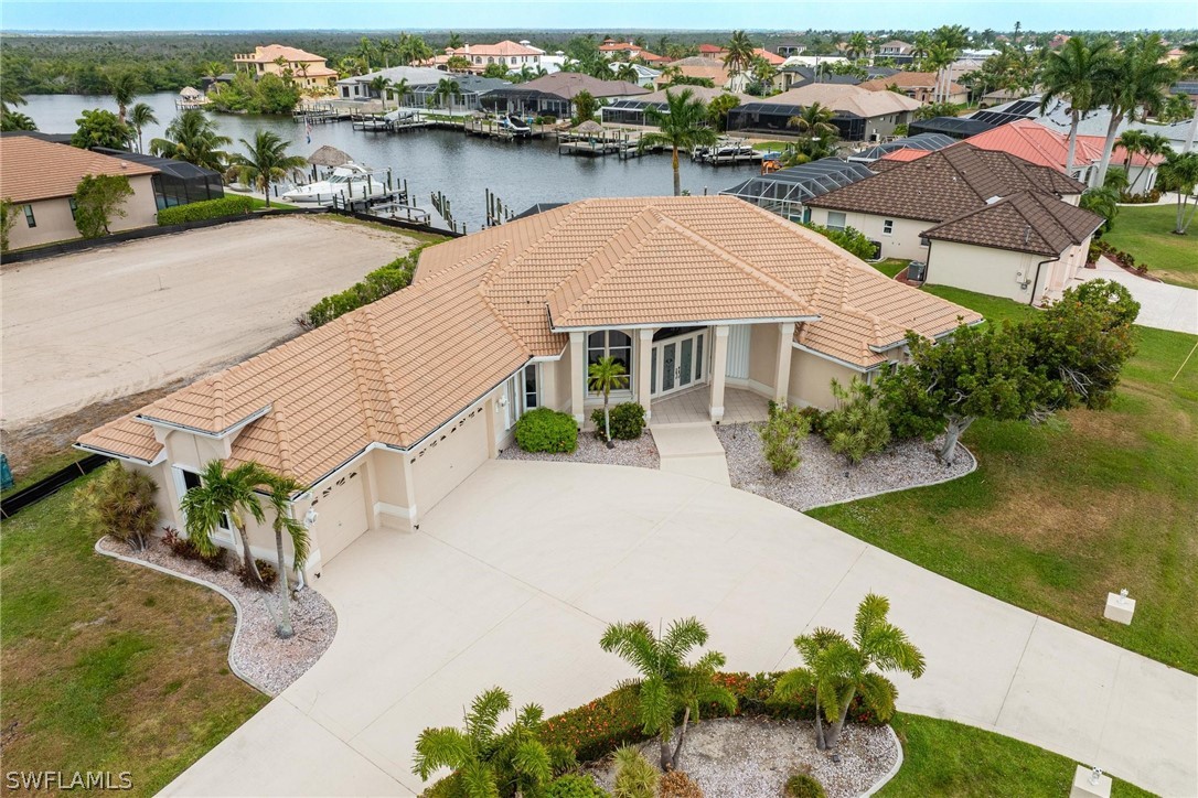 a aerial view of a house with a lake view