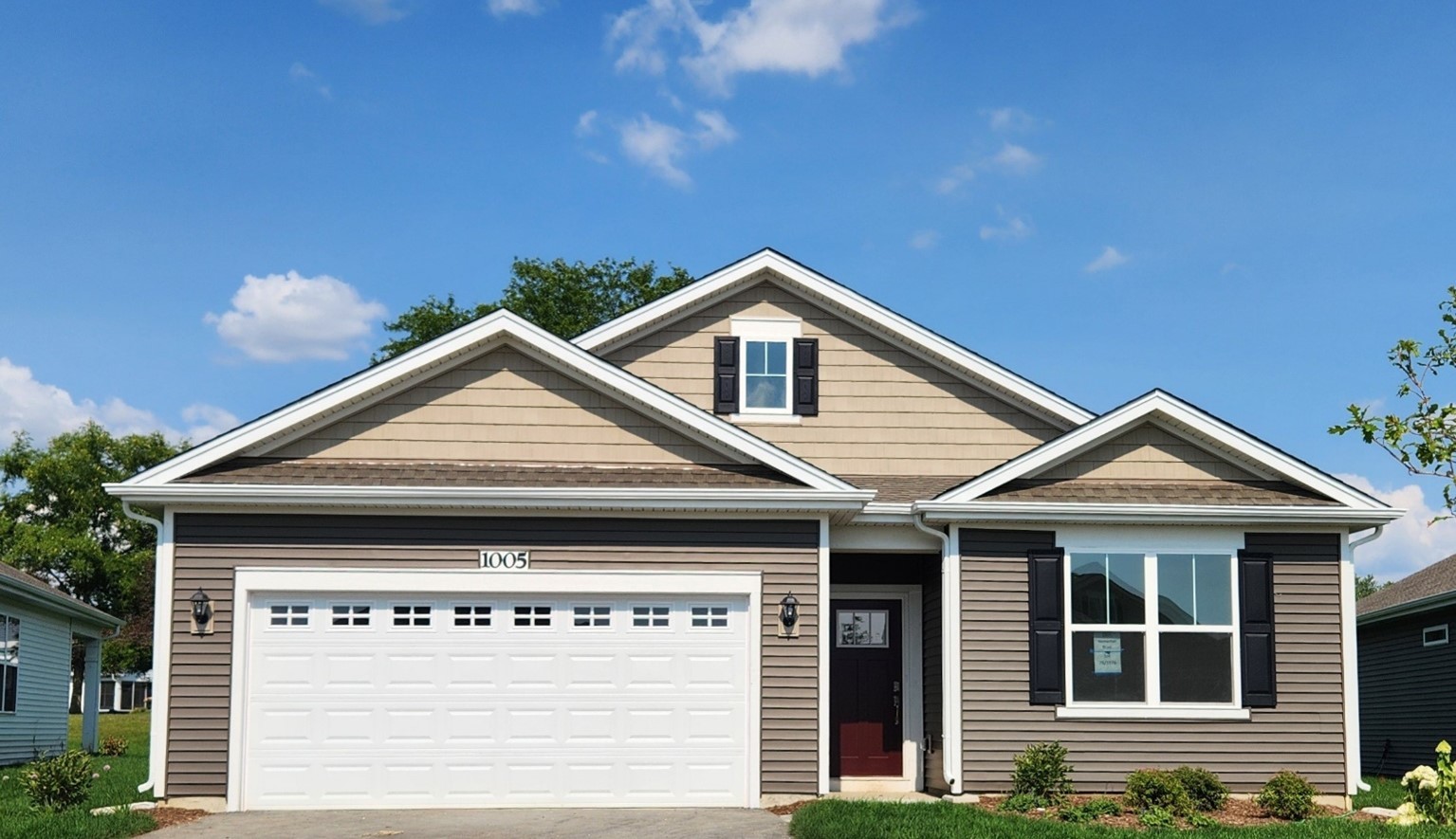 a front view of a house with a garage