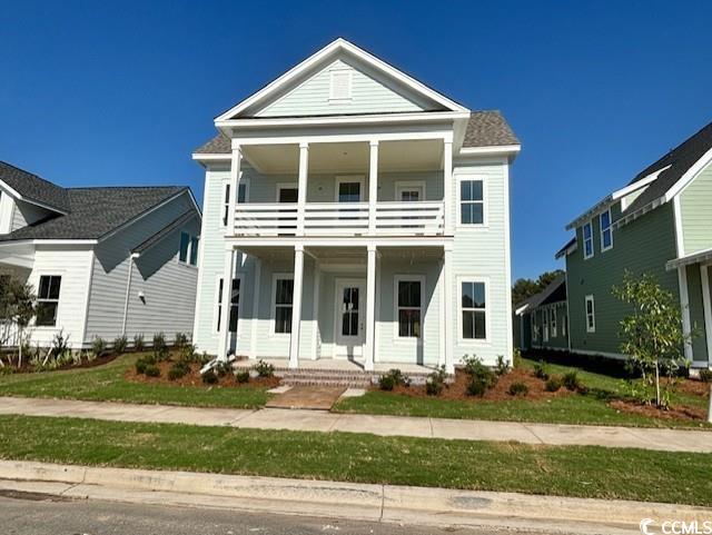 featuring covered porch and a balcony