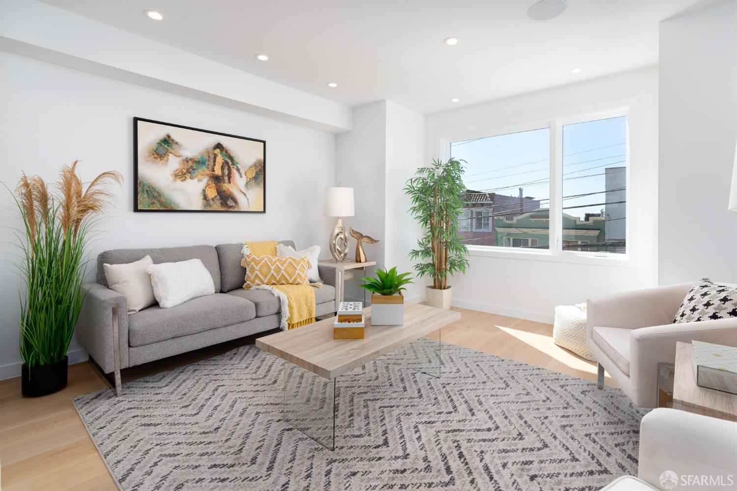 a living room with furniture and a large window