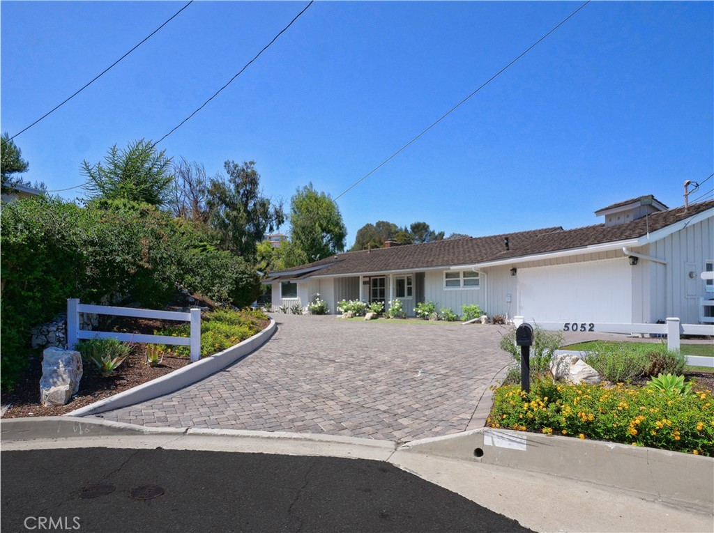 a house view with a garden space