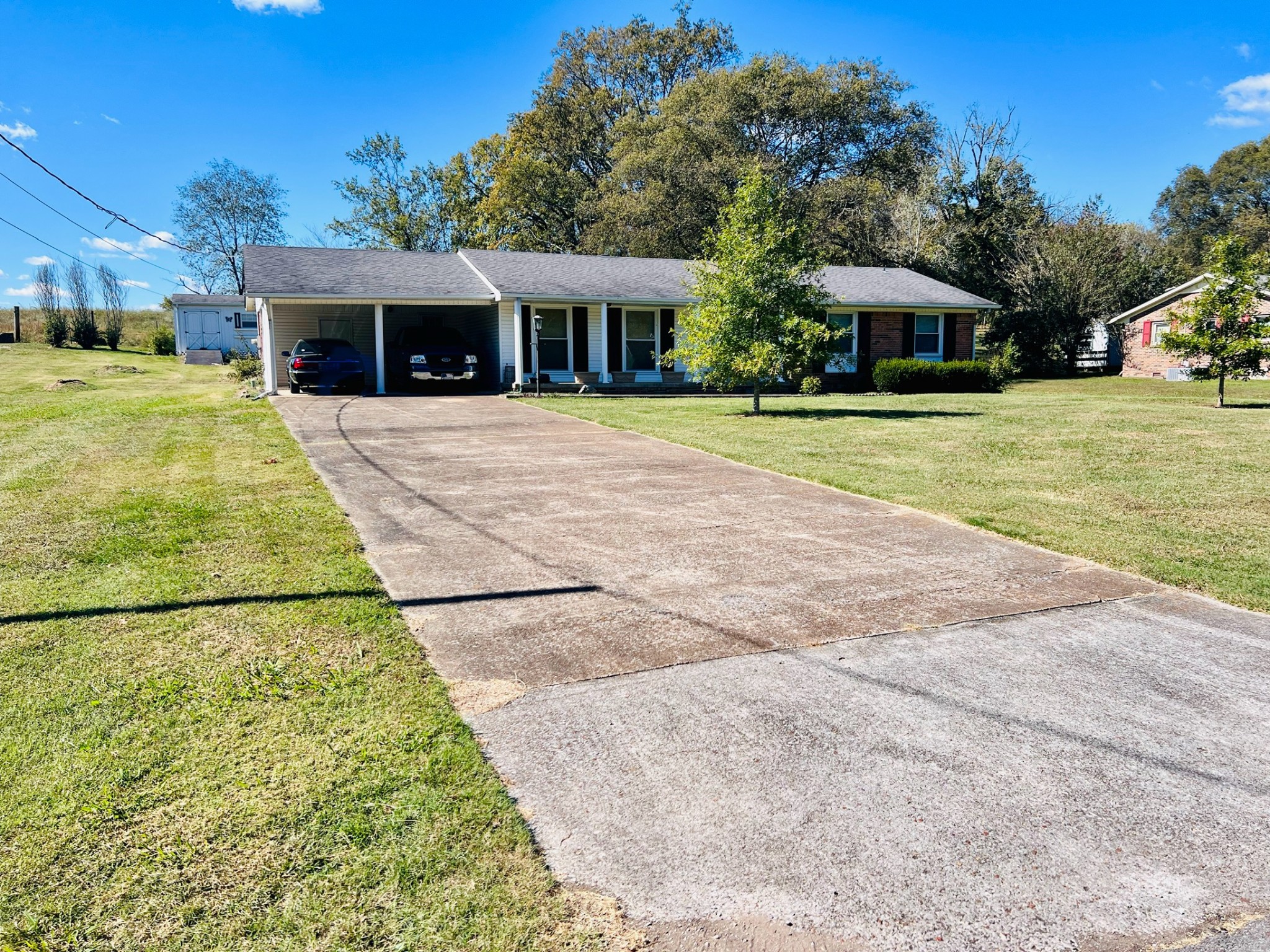 a view of house with yard