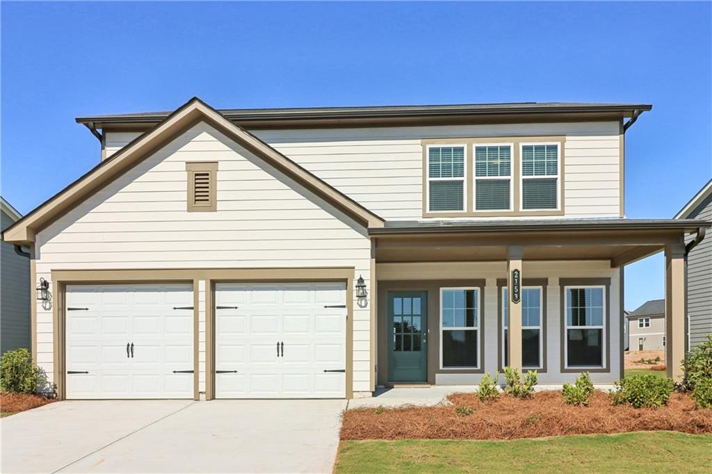 front view of a house with a yard