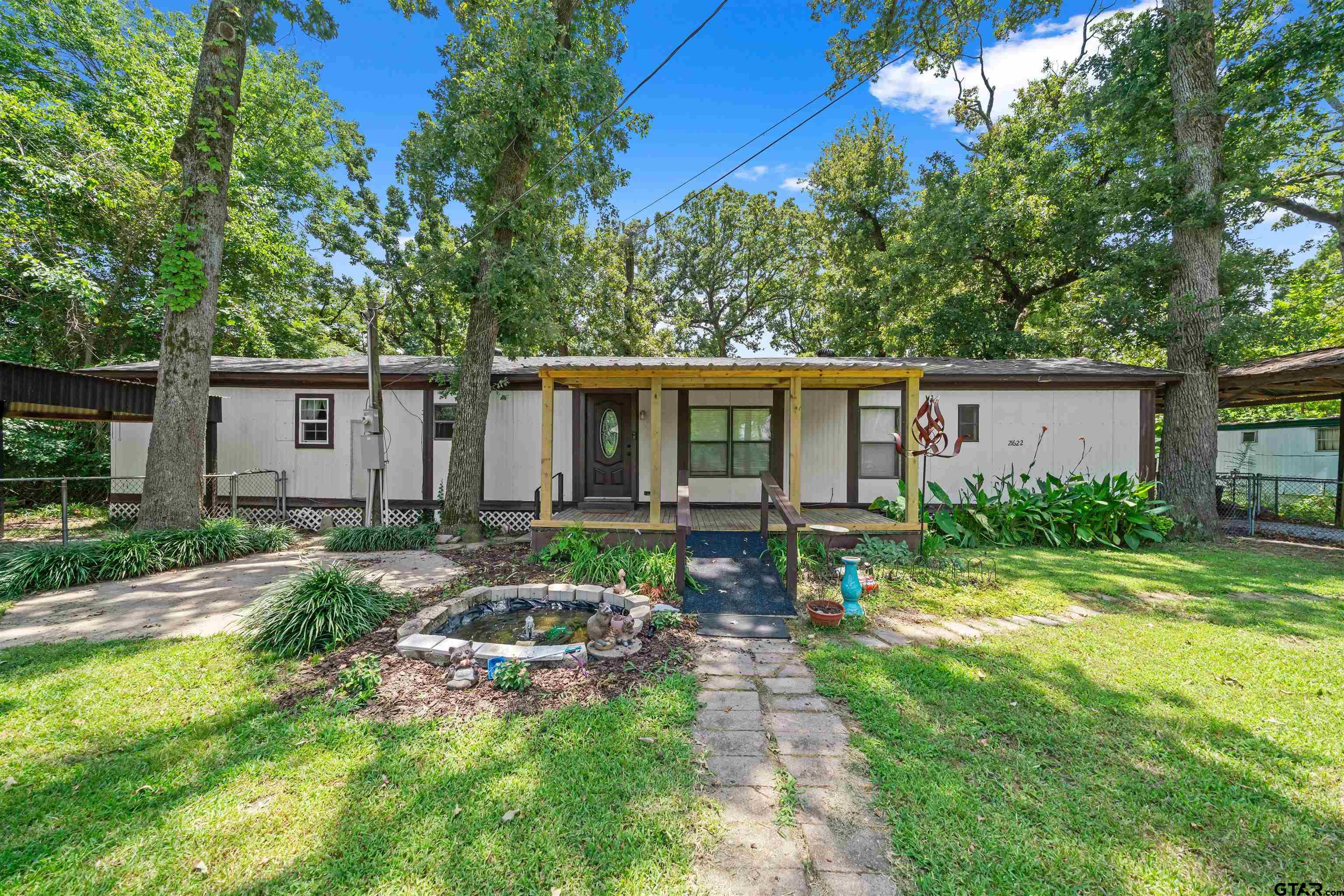 front view of a house with a yard