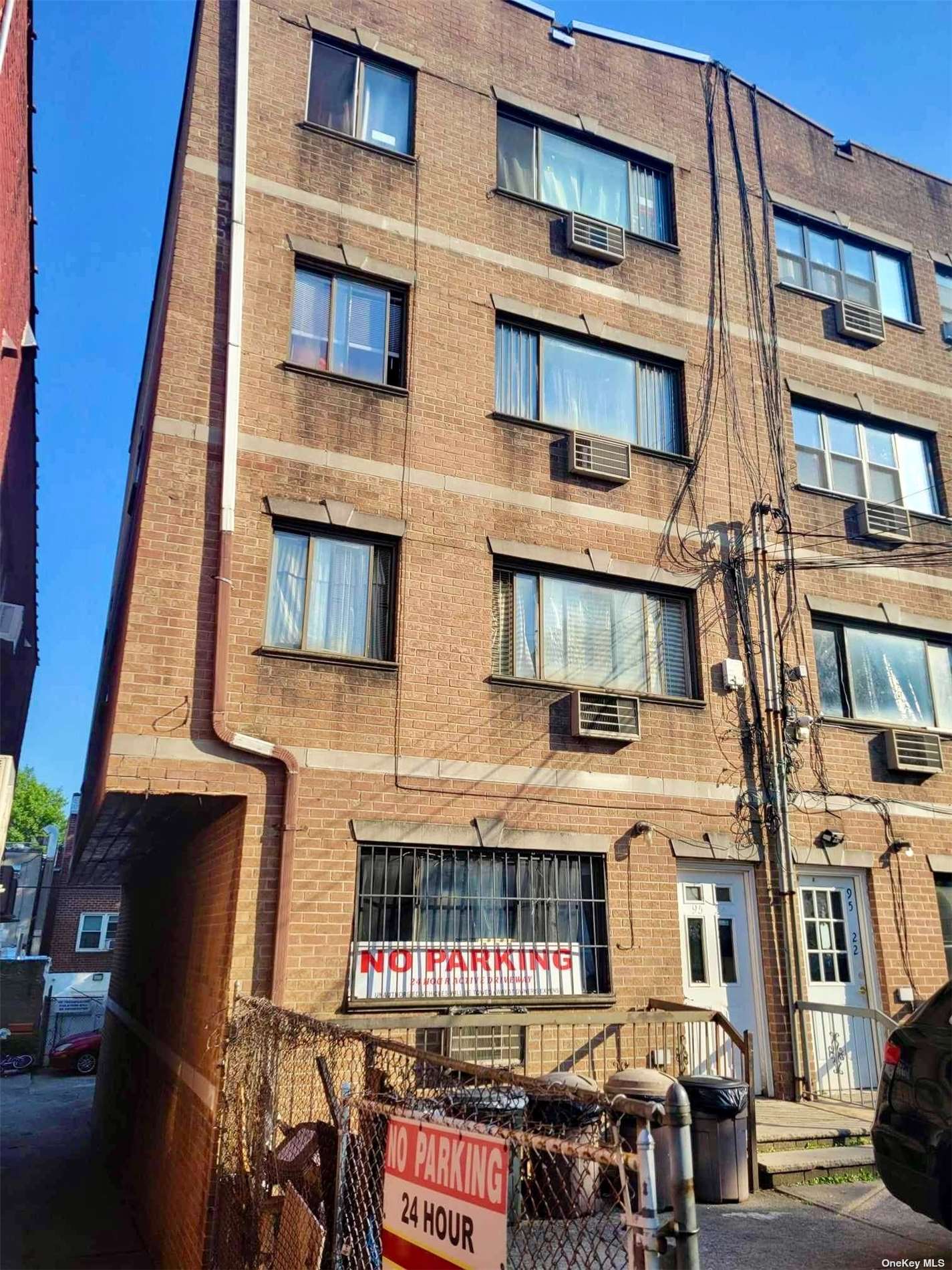 a front view of a building with glass windows