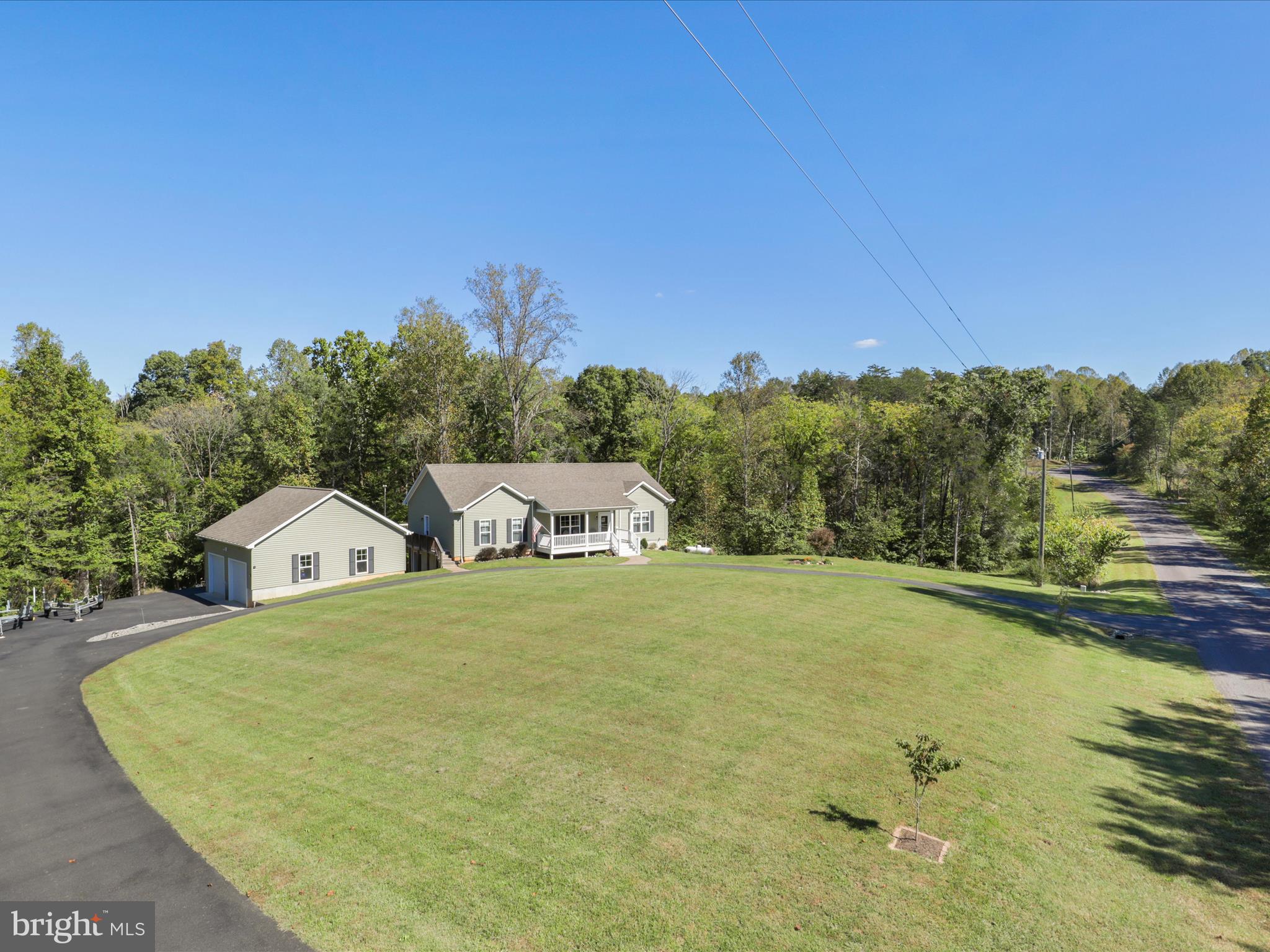 a view of a big room with a yard and mountain view