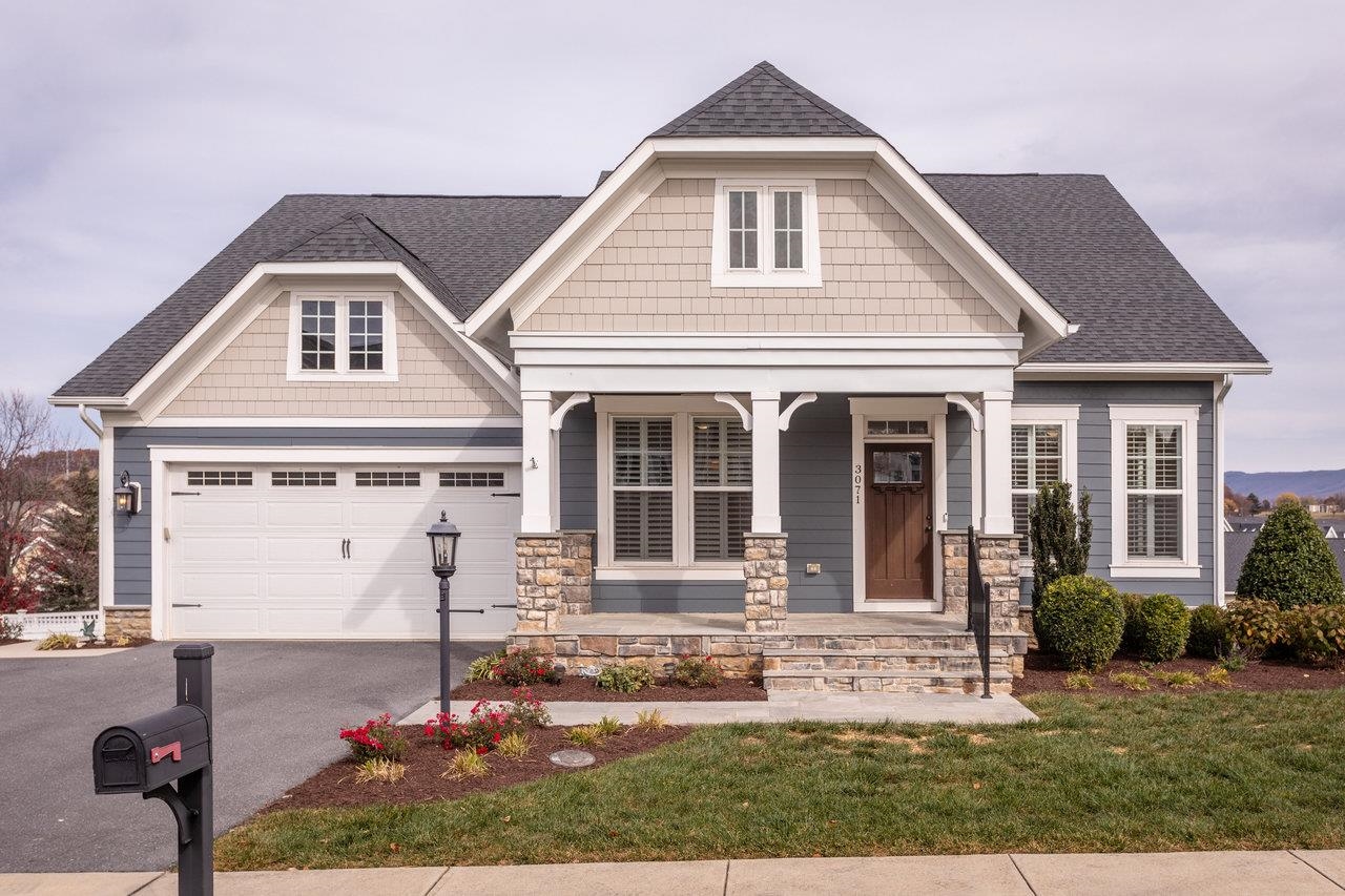 front view of a house with a yard