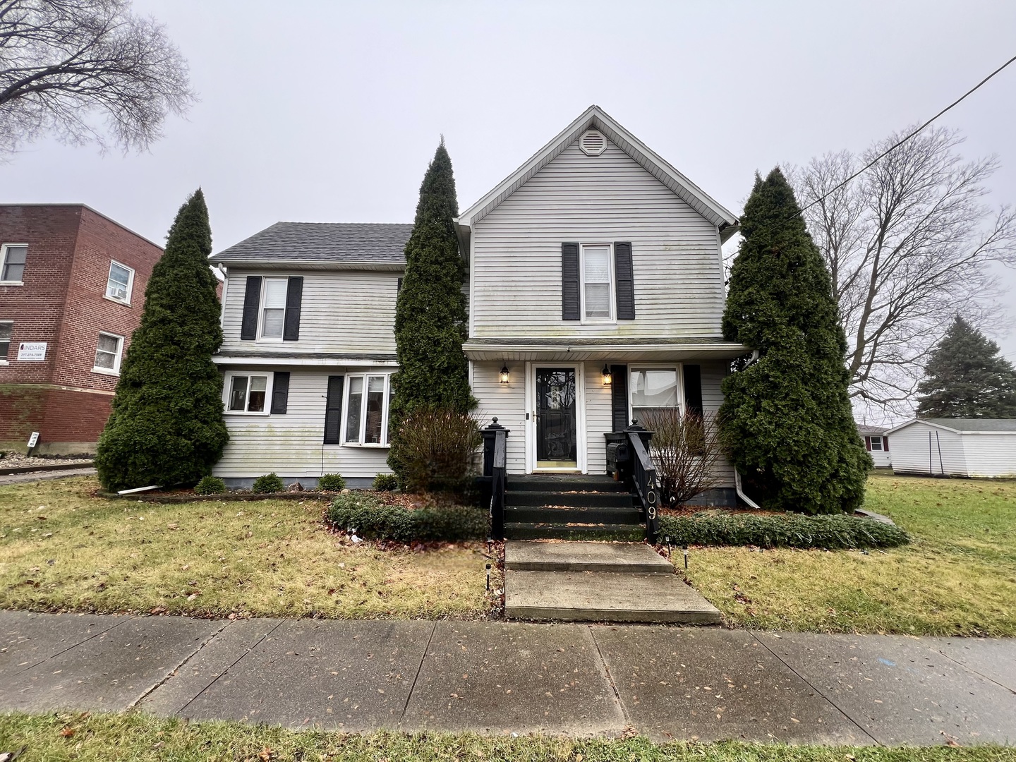 a front view of a house with a yard