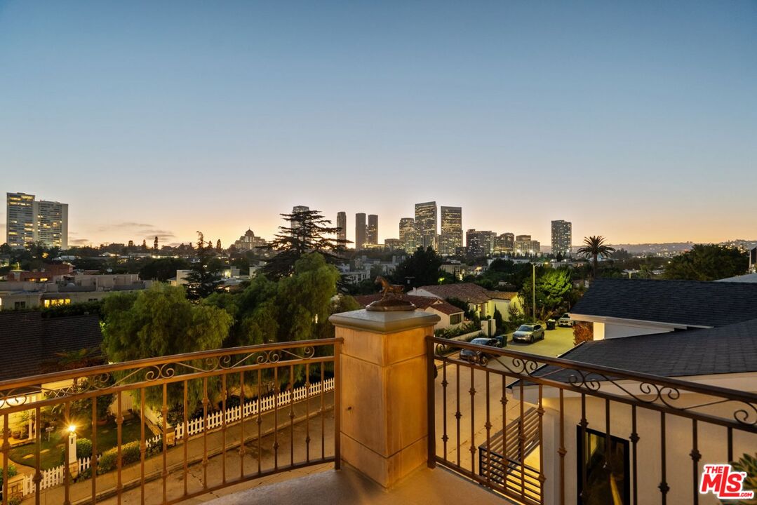 a view of a balcony with city view