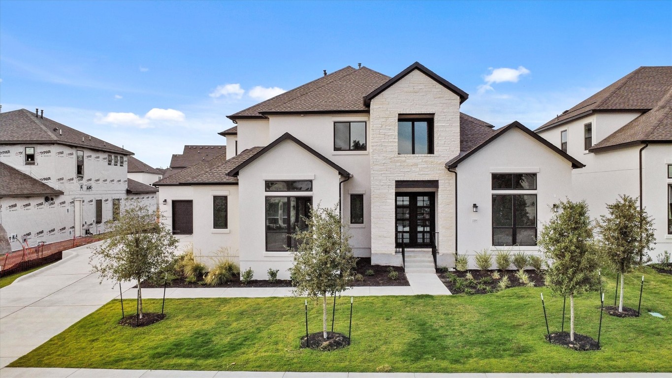 a front view of a house with a yard