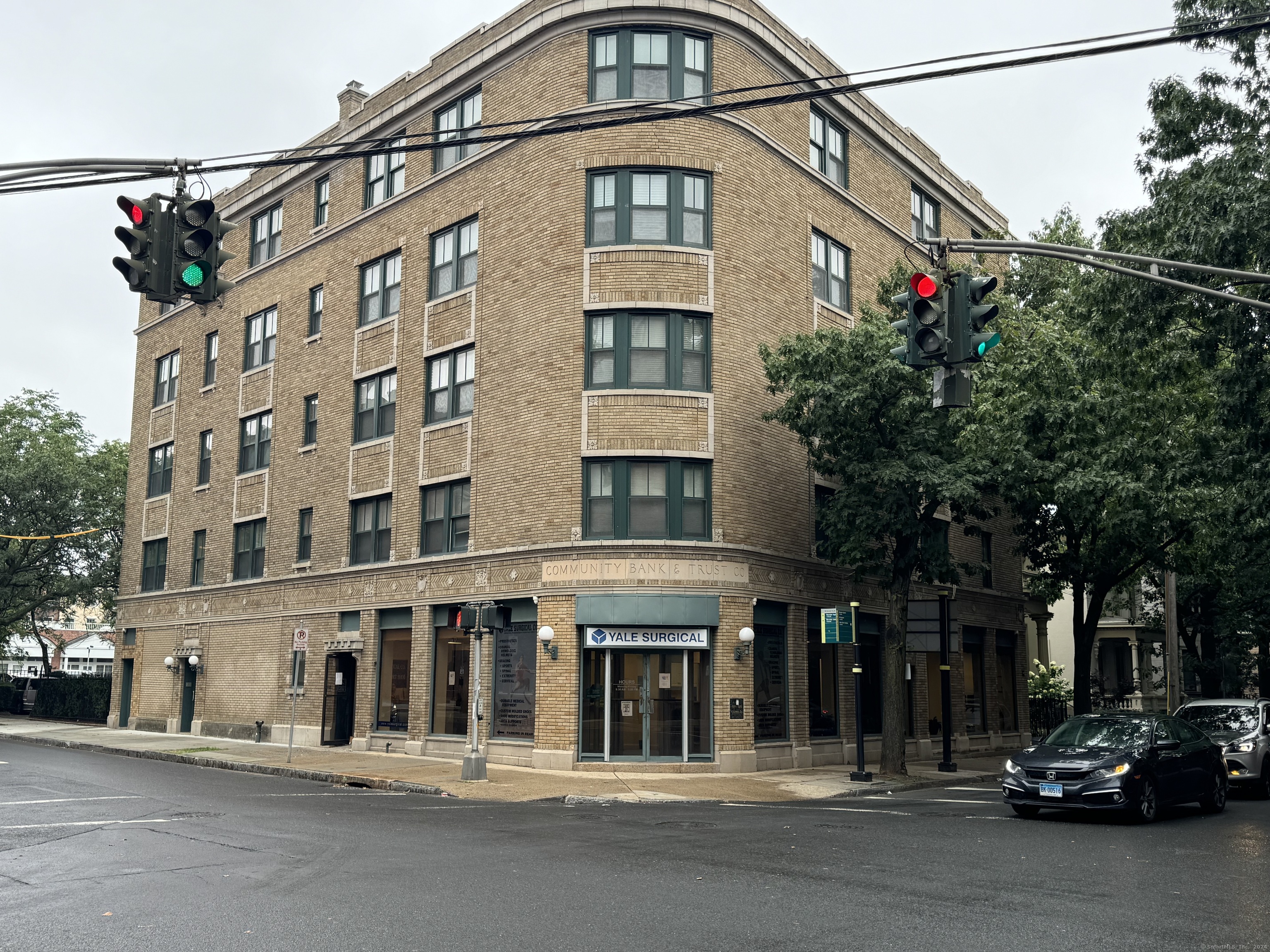 a front view of a building with street view